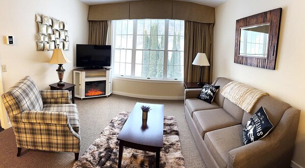 Stylish, and comfortable Mountain Decor. Couch opens up to a QUEEN sofa bed