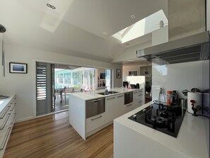 Kitchen with doors opening onto patio.