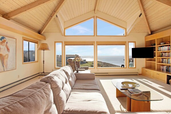 Relax in the living room, where large picture windows frame stunning ocean views.