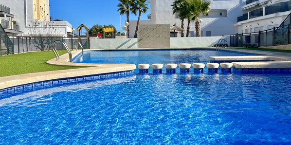 Communal swimming pool perfect for enjoying and cooling off.