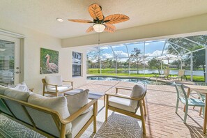Lake Vista - Enjoy the stunning lake view from the screened in pool area with heated pool