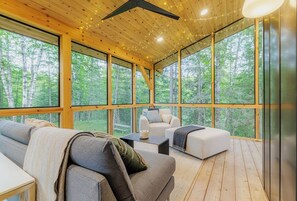 Fully screened porch with lounge seating and right off of the dining room.