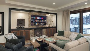 Great room fireplace and TV for entertaining