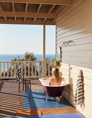 Soak in the outdoor bathtub with a view, where the warm water, fresh ocean air, and endless blue horizons create the ultimate open-air retreat.