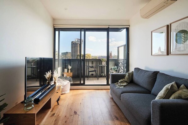 The light-filled living area offers a sofa to settle in with some TV, while split system air conditioning and heating ensure year-round comfort. 