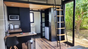 Functional kitchenette with essential appliances for easy and convenient meals.