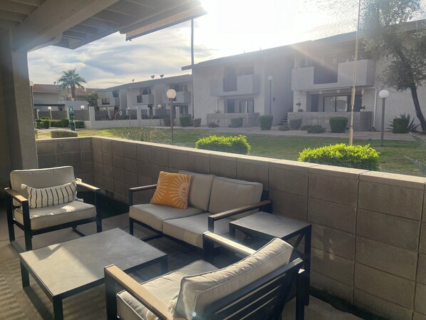 Beautiful patio facing serene courtyard. Entry from living room and bedroom