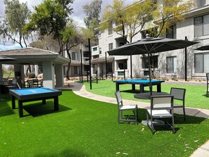 Right outside your front door...courtyard with pool table, ping pong, cornhole