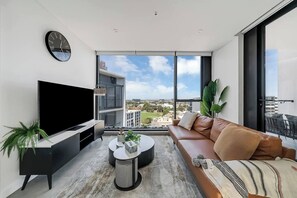The light-filled living space includes a large sofa and TV so you can settle in after a day of work or sightseeing, with split system air conditioning and heating ensuring year-round comfort. 
