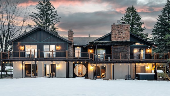 Shanty Creek home with sauna, jacuzzi, fire-pit, putting green, & sunset views.