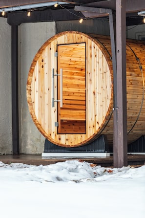 Cozy 6-person cedar sauna with sunset views, perfect after skiing or hiking.