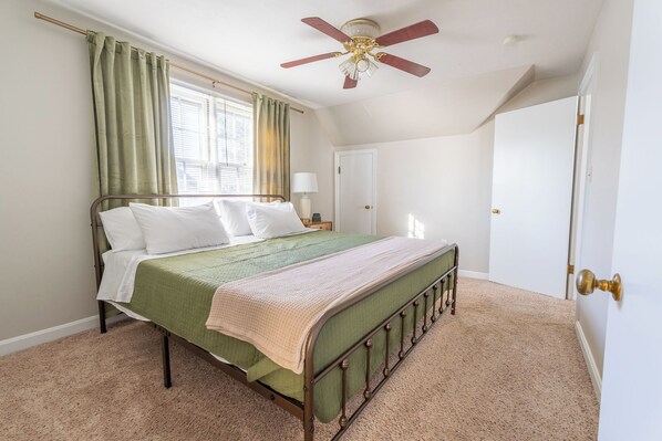 King size bed with medium firm mattress and 4 pillows.  

