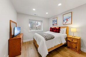 Exceptionally comfy queen size bed and TV in 2nd bedroom.