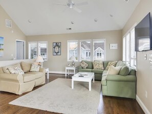Comfortable living area featuring plush seating and large windows that fill the space with natural light.