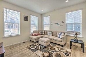 Bright and inviting living area featuring a comfortable sectional sofa and tasteful decor. The space is perfect for relaxation after a day of exploration.