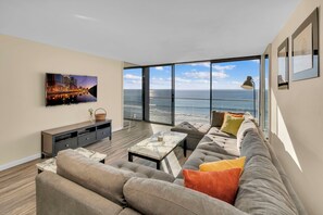 Living room with huge sofa and smart TV