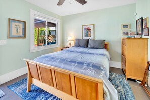 Queen bed, smart TV, dresser, wardrobe closet.