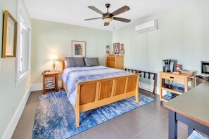 Queen bed, smart TV, dresser, wardrobe closet, some small kitchen appliances.
