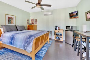 Queen bed, smart TV, dresser, wardrobe closet.