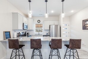 Fully Equipped Kitchen with Additional Bar Seating