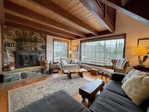 Inside, classic rustic charm meets modern comfort from wide plank flooring to exposed wood beams to cozy décor