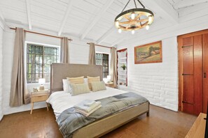 Serenity in Sheets: A king-sized bed for your royal slumber.
