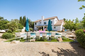 Large and private backyard with *heated pool, hot tub, putting green, fruit trees and more!