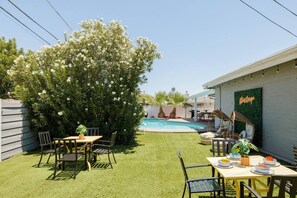 Super cozy seating space on the other side of the yard to take a break from all the swimming!