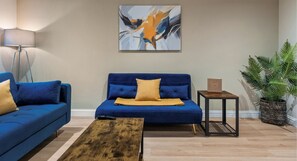 Relax in style in our cozy living room with a comfy sofa – your perfect spot to unwind.