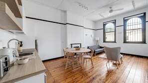 Bright and airy combined kitchen and living area with a clean aesthetic.