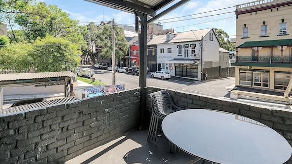 Outdoor seating to relax and enjoy the vibrant neighbourhood.