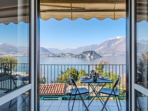 Body Of Water, Mountainous Landforms, Mountain, Furniture, Hill, Coastal And Oceanic Landforms, Lake, Chair, Sea, Mountain Range