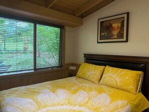 Main bedroom with ensuite bathroom, Samsung Smart TV and garden views