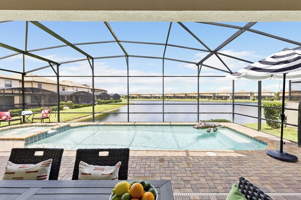 Screened pool and al fresco dining.