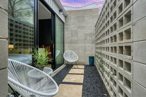 A perfect spot to enjoy the fresh air, with comfortable seating and charming details.