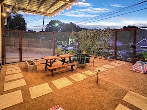 Enjoy the Central TX Skyline and relax on the patio with string lights, outdoor furniture, cornhole, and firepit!