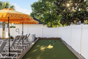 Bocce ball - this setup provides a relaxing and fun environment for both lounging and engaging in games.