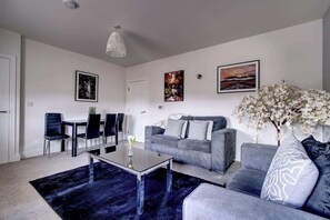 Kick back, grab the remote, and stream your favorites on Netflix in this cosy lounge