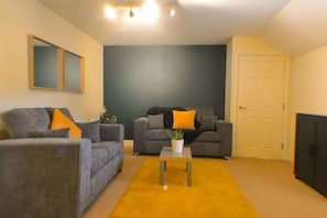 Make yourself at home in this snug lounge with soft lighting and comfortable seating