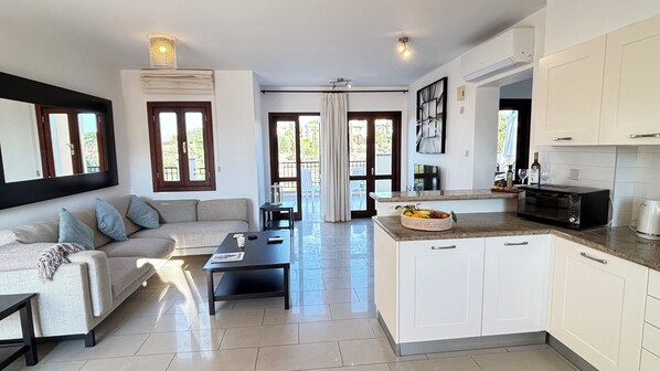 living room with open space kitchen