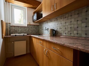 Kitchen, Countertop, Wood, Flooring, Cabinetry, Interior Design, Floor, Kitchen Appliance, Kitchen Sink, Tap