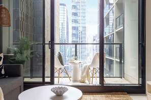 A balcony with city views. (chairs on balcony are from the dining area)