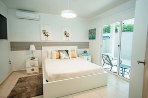 This room offers a queen-sized bed with direct patio access for that perfect morning coffee moment