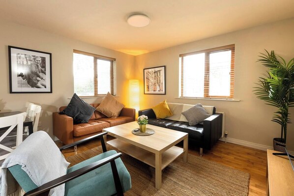 Open plan living room to kitchen - gas central heating and 55 inch smart tv .