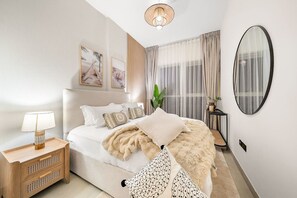 Bedroom Retreat: Elegant decor and warm lighting create a serene escape for restful nights!
