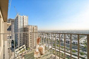 Balcony Bliss: Savor stunning skyline views from this stylish balcony retreat!