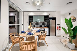Dining Area: Enjoy vibrant meals with a modern kitchen and stylish decor in this bright space!