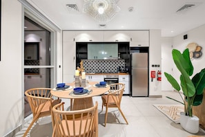 Dining Area: Enjoy vibrant meals with a modern kitchen and stylish decor in this bright space!