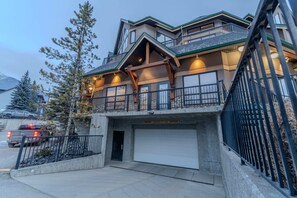 Stunning exterior view of the condo complex, showcasing its modern alpine architecture and prime location.