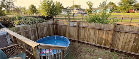 Relax in the Cowboy Pool or on the back porch overlooking the Lafitte Greenway!
